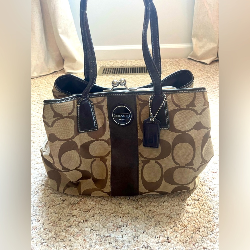 Coach purse with brown/tan monogram canvas and leather straps